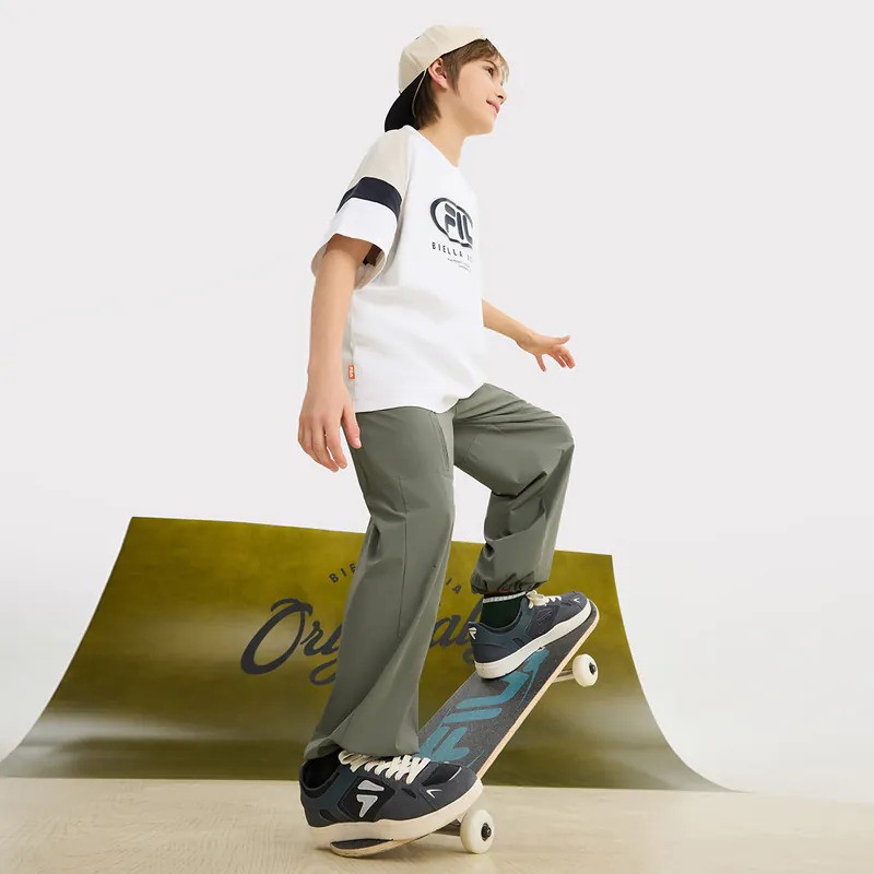 A lifestyle shot of a model wearing FILA apparel.
