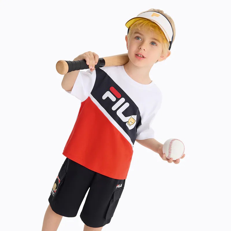 A lifestyle shot of a model wearing FILA apparel.